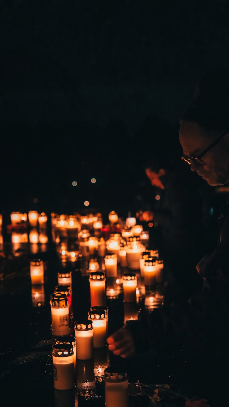 a person lightning the candle