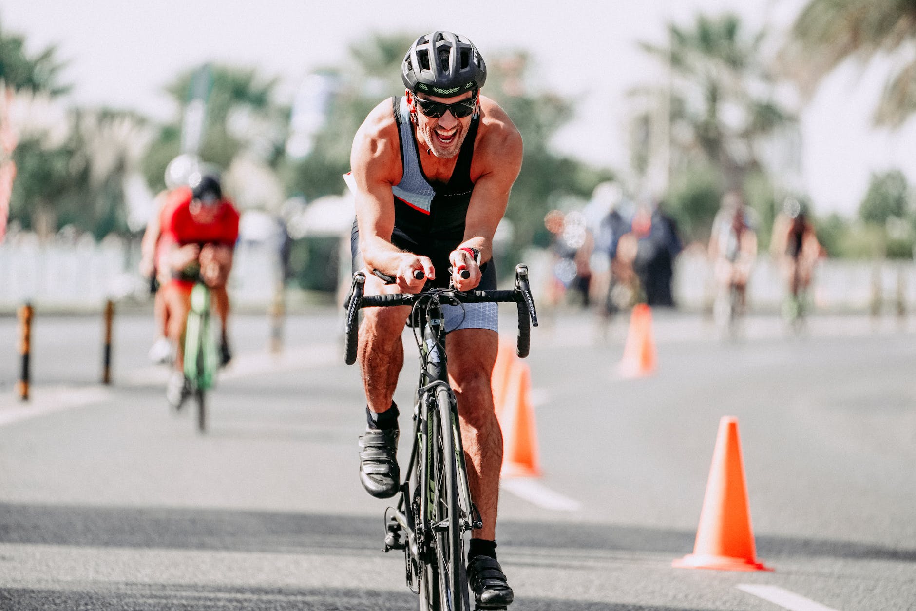 determined cyclist riding bike on road during race